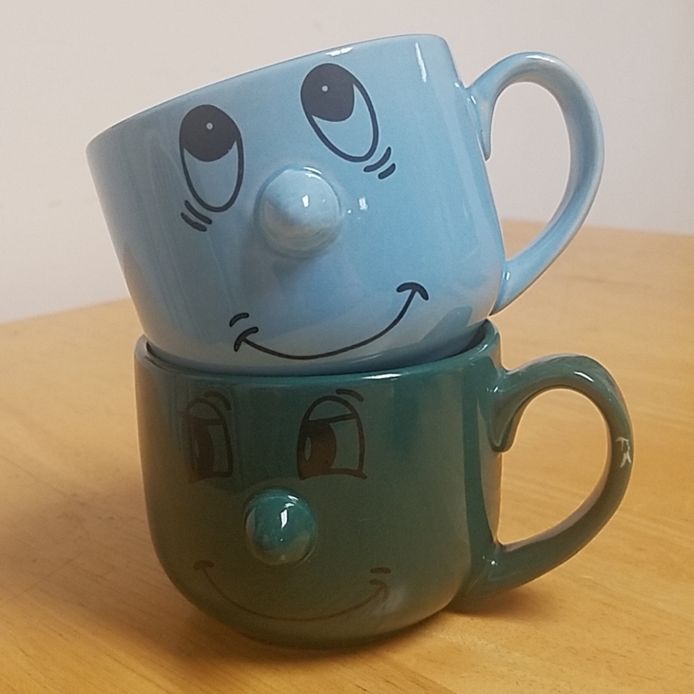 Mugs with Cute Faces! One Blue, One Green